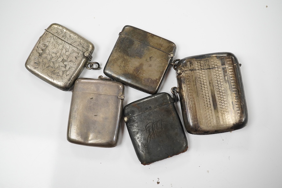 Five assorted late 19th/early 20th century silver vesta cases, largest 58mm. Condition - poor to fair